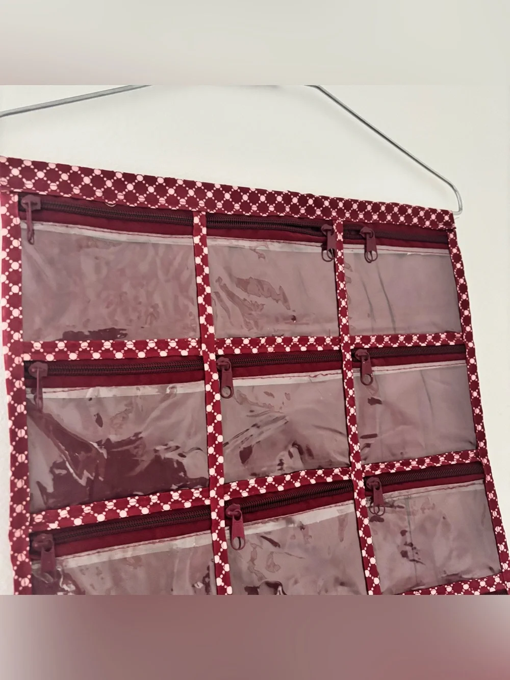 Burgundy patterned hanger organizer with 13 pockets